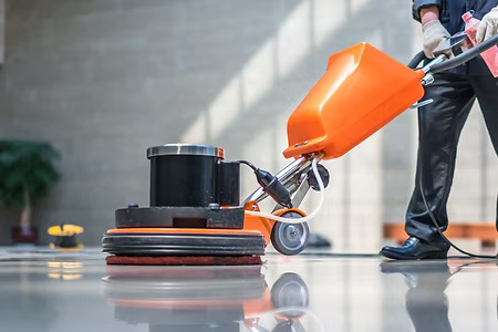 Industrial floor polisher preparing surface after renovation