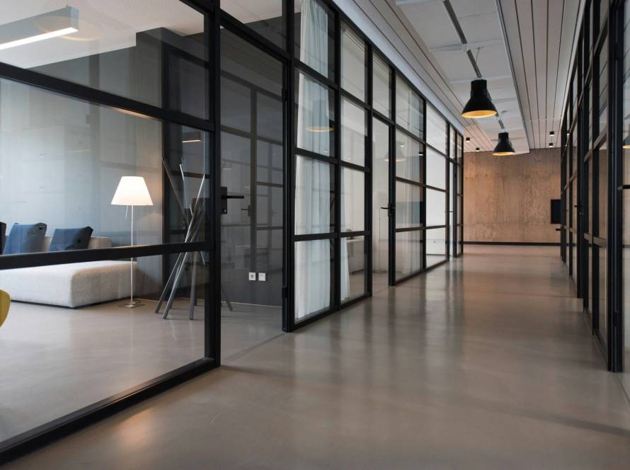 Spotless commercial office with polished floors and glass dividers