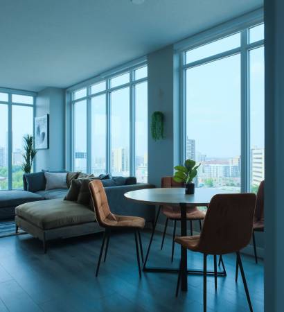 WhatsApp Image 2025-06-11 at 13.14.11_571569ef Clean and bright condo living space with large windows and modern furniture